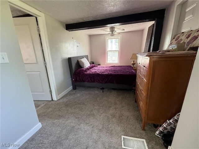 405 E Oxford St, Alliance, OH 44601 - carpeted bedroom with a textured ceiling, baseboards, and beamed ceiling