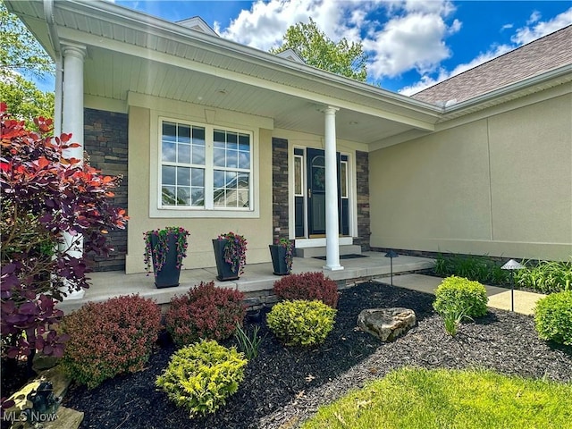6836 Twin Oaks Ct, Canfield, OH 44406 - entrance to property featuring covered porch, stone siding, roof with shingles, and stucco siding