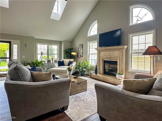 6836 Twin Oaks Ct, Canfield, OH 44406 - living area with high vaulted ceiling, a fireplace, wood finished floors, and a skylight