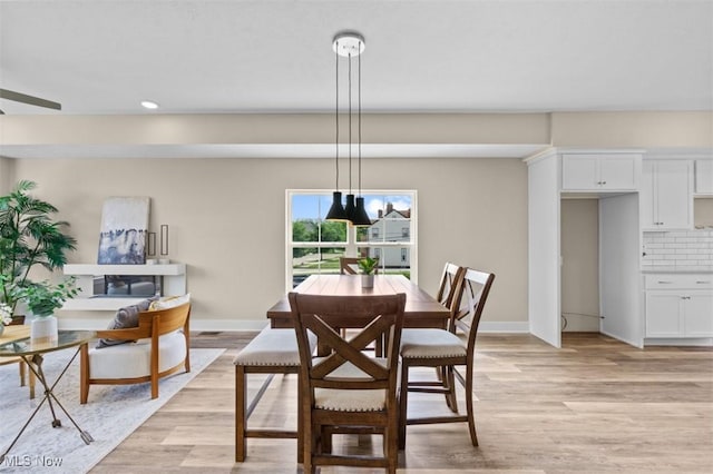 2087 Wynn Rd, Cleveland, OH 44118 - dining area featuring light wood-style flooring, baseboards, and recessed lighting