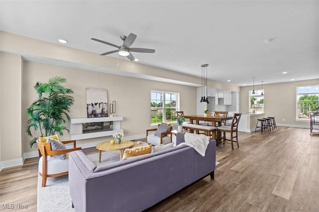2087 Wynn Rd, Cleveland, OH 44118 - living area with wood finished floors, recessed lighting, baseboards, and a ceiling fan