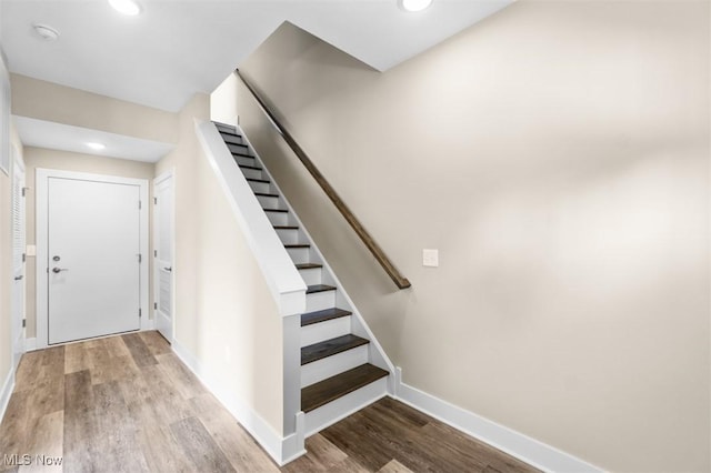 2087 Wynn Rd, Cleveland, OH 44118 - stairs featuring wood finished floors, baseboards, and recessed lighting