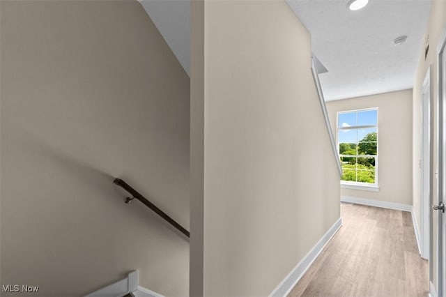 2087 Wynn Rd, Cleveland, OH 44118 - stairway featuring baseboards and wood finished floors