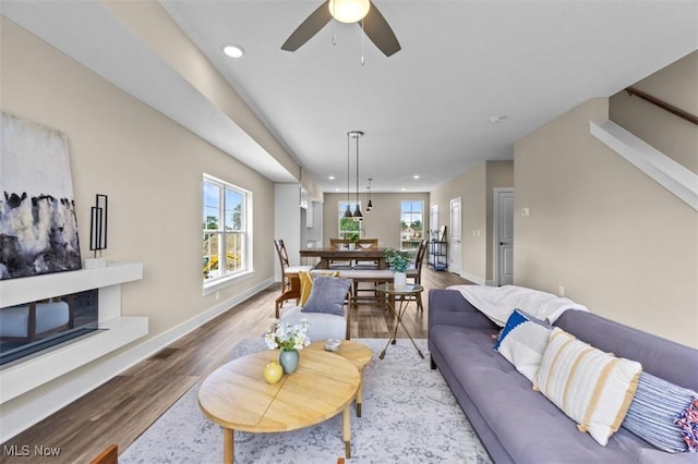 2087 Wynn Rd, Cleveland, OH 44118 - living room with wood finished floors, plenty of natural light, recessed lighting, a ceiling fan, and baseboards