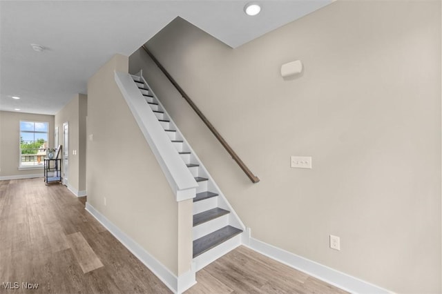 2087 Wynn Rd, Cleveland, OH 44118 - stairs featuring wood finished floors, baseboards, and recessed lighting