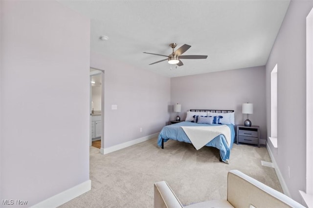 2087 Wynn Rd, Cleveland, OH 44118 - carpeted bedroom with baseboards, a ceiling fan, and connected bathroom