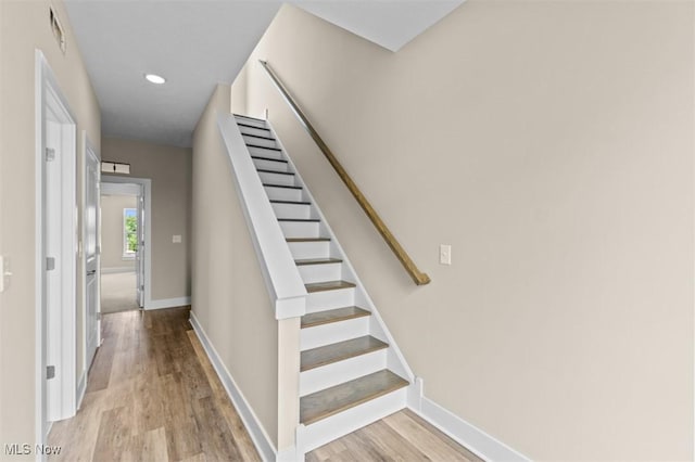 2087 Wynn Rd, Cleveland, OH 44118 - staircase featuring wood finished floors, baseboards, and recessed lighting