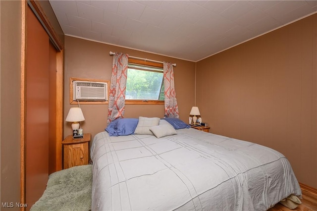 272 Cheyenne Trl, Malvern, OH 44644 - bedroom with ornamental molding, an AC wall unit, and wood finished floors