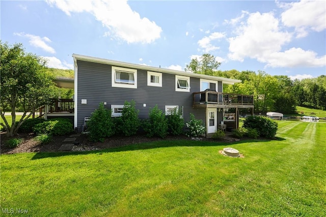 272 Cheyenne Trl, Malvern, OH 44644 - rear view of property featuring a deck and a yard