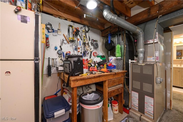 272 Cheyenne Trl, Malvern, OH 44644 - basement featuring a workshop area and freestanding refrigerator