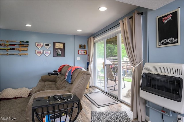 272 Cheyenne Trl, Malvern, OH 44644 - living room featuring heating unit, wood finished floors, and recessed lighting