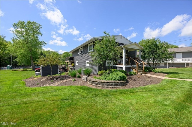 272 Cheyenne Trl, Malvern, OH 44644 - back of property featuring a porch and a yard