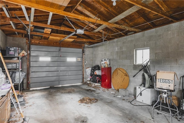1608 Lawrence St, Parkersburg, WV 26101 - garage with concrete block wall and a garage door opener