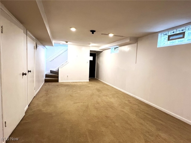 1585 Hilda St, Lakemore, OH 44250 - basement with carpet flooring, stairway, baseboards, and recessed lighting