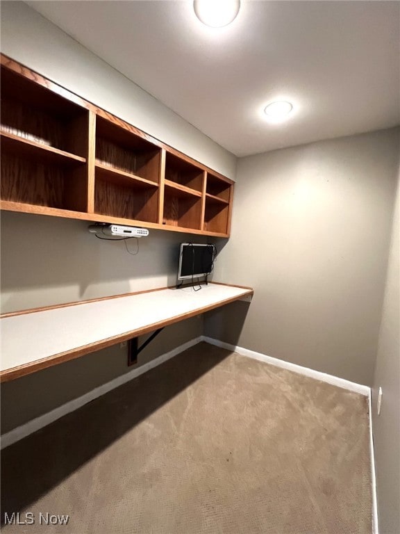 1585 Hilda St, Lakemore, OH 44250 - unfurnished office with built in desk, carpet, and baseboards