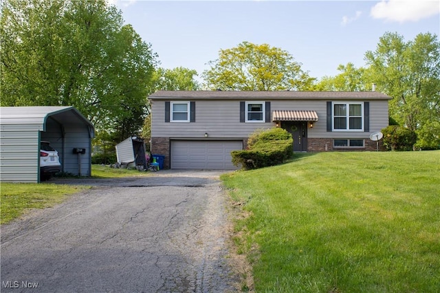6333 Warren Sharon Rd, Oh, OH 44403 - split foyer home with asphalt driveway, a front lawn, a carport, brick siding, and an attached garage