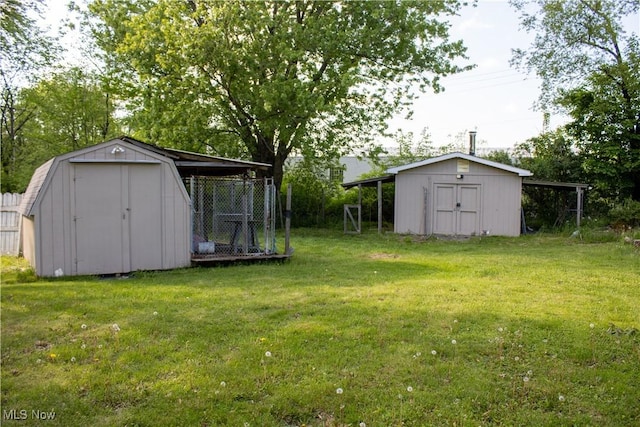 6333 Warren Sharon Rd, Oh, OH 44403 - view of grassy yard with a storage shed and an outbuilding