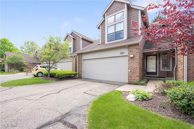 4568 Avondale Blvd NW, Canton, OH 44708 - traditional home with brick siding, driveway, an attached garage, and a shingled roof