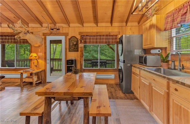 7324 Ferngreen Rd, Carrollton, OH 44615 - kitchen featuring stainless steel microwave, a sink, wooden ceiling, stacked washing machine and dryer, and wood finished floors