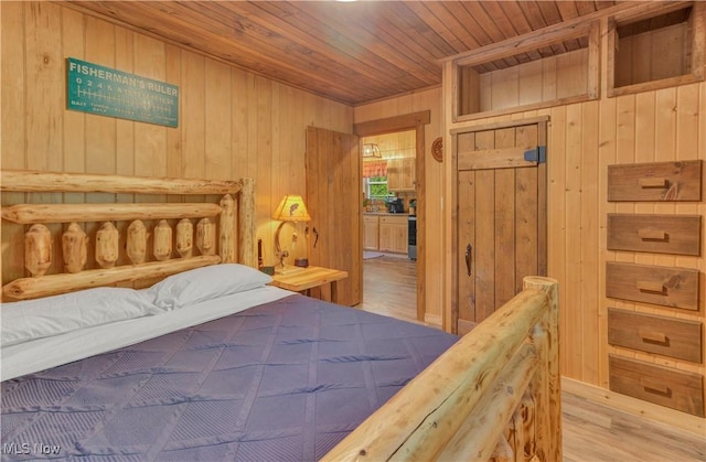 7324 Ferngreen Rd, Carrollton, OH 44615 - bedroom with wood ceiling, wood walls, and wood finished floors