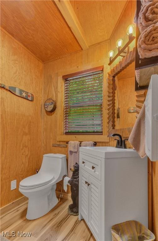 7324 Ferngreen Rd, Carrollton, OH 44615 - half bathroom with wooden ceiling, wooden walls, wood finished floors, toilet, and vanity
