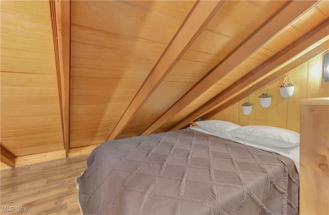 7324 Ferngreen Rd, Carrollton, OH 44615 - bedroom with wood ceiling, light wood-style floors, and wooden walls