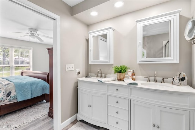 114 W Cherokee Trl, Bayview, OH 44870 - ensuite bathroom featuring ceiling fan, double vanity, wood finished floors, recessed lighting, and baseboards
