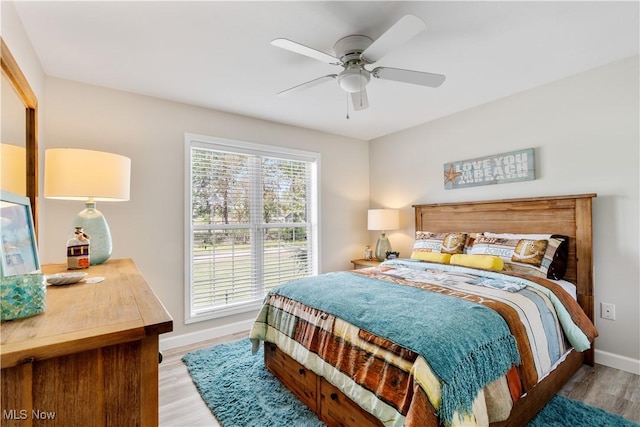 114 W Cherokee Trl, Bayview, OH 44870 - bedroom featuring wood finished floors, baseboards, and ceiling fan