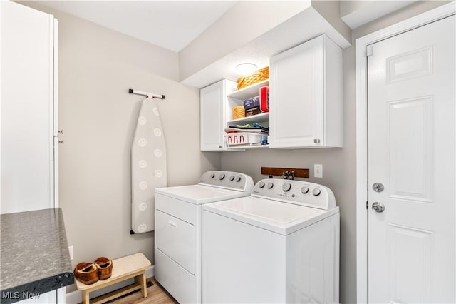 114 W Cherokee Trl, Bayview, OH 44870 - clothes washing area featuring cabinet space and independent washer and dryer