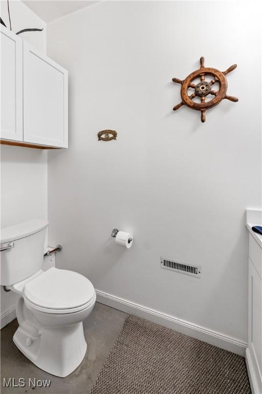 114 W Cherokee Trl, Bayview, OH 44870 - bathroom with baseboards, toilet, and vanity