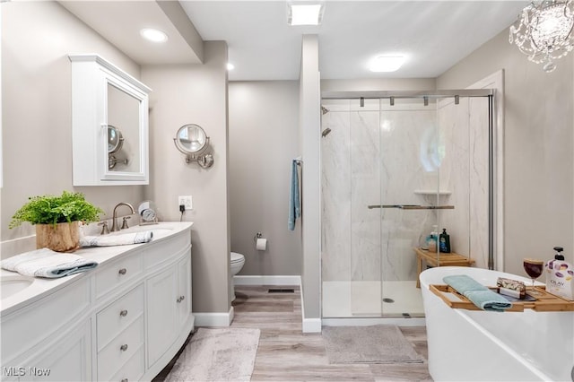 114 W Cherokee Trl, Bayview, OH 44870 - full bathroom with toilet, a stall shower, a freestanding bath, double vanity, and recessed lighting