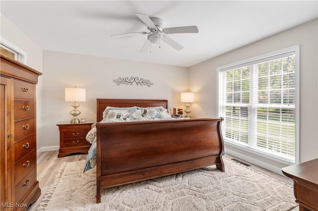 114 W Cherokee Trl, Bayview, OH 44870 - bedroom featuring light wood-type flooring, baseboards, and a ceiling fan