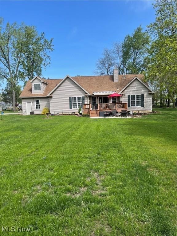 114 W Cherokee Trl, Bayview, OH 44870 - rear view of house with a yard, a deck, and a chimney