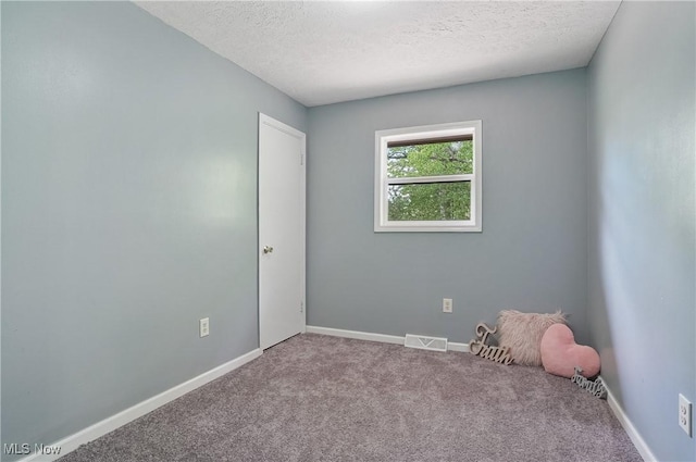 10699 Whippoorwill Rd, Newton Falls, OH 44412 - carpeted spare room with a textured ceiling and baseboards