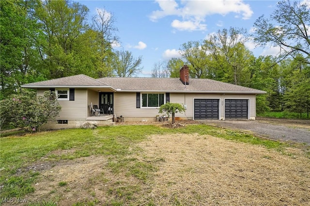 10699 Whippoorwill Rd, Newton Falls, OH 44412 - ranch-style home with a garage, a chimney, driveway, and a front yard