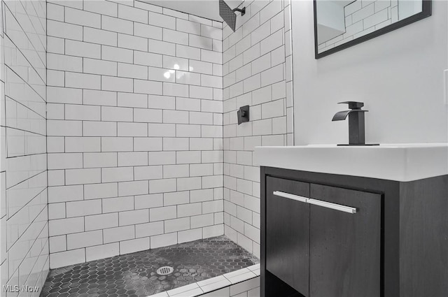bathroom with tiled shower