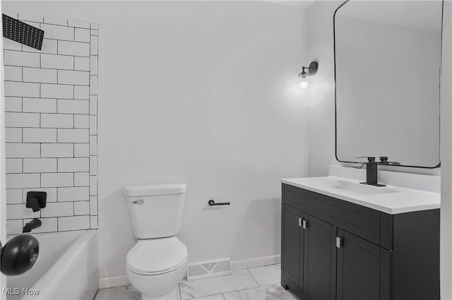 bathroom featuring marble finish flooring, baseboards, toilet, vanity, and shower / tub combination