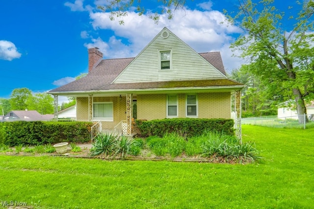 7026 S Boyden, Northfield, OH 44067 - view of front of property with a chimney, brick siding, and a porch