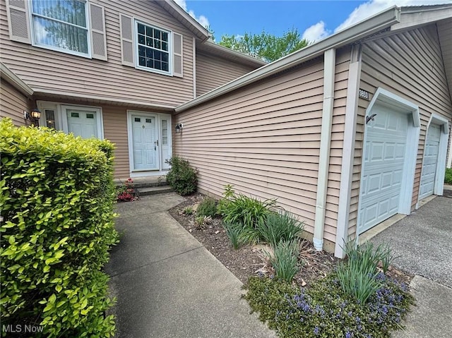 3853 Lake Run Blvd, Stow, OH 44224 - property entrance with a garage and asphalt driveway