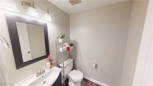 3853 Lake Run Blvd, Stow, OH 44224 - half bath featuring toilet, a sink, wood finished floors, and baseboards