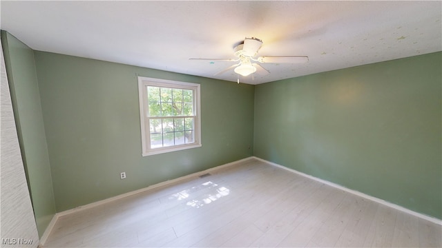 3853 Lake Run Blvd, Stow, OH 44224 - spare room featuring ceiling fan, wood finished floors, and baseboards