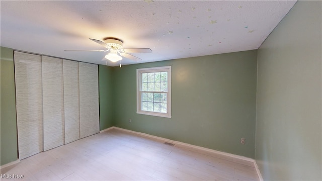 3853 Lake Run Blvd, Stow, OH 44224 - unfurnished bedroom with a ceiling fan, light wood-style flooring, a closet, and baseboards