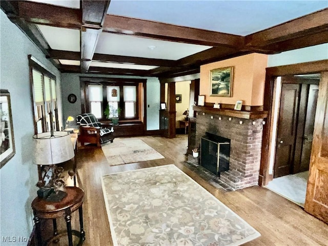 2508 Queenston Rd, Cleveland Heights, OH 44118 - living area featuring wood finished floors, beamed ceiling, coffered ceiling, and a brick fireplace