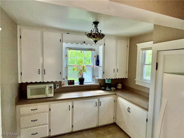 2508 Queenston Rd, Cleveland Heights, OH 44118 - kitchen with white microwave and white cabinetry