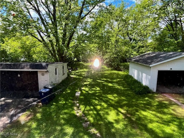 2508 Queenston Rd, Cleveland Heights, OH 44118 - view of green lawn featuring an outdoor structure and a detached garage