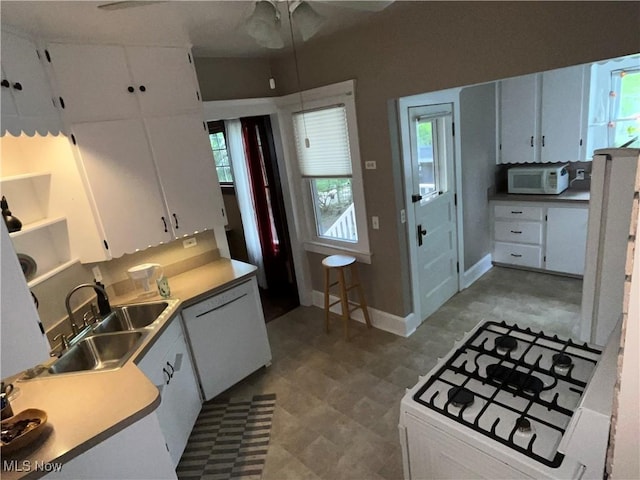2508 Queenston Rd, Cleveland Heights, OH 44118 - kitchen with white appliances, light flooring, light countertops, and white cabinetry