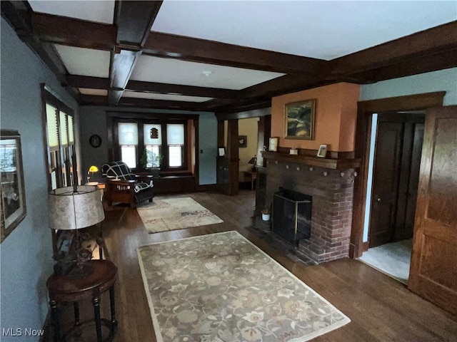 2508 Queenston Rd, Cleveland Heights, OH 44118 - living room featuring wood finished floors, beam ceiling, coffered ceiling, and a brick fireplace