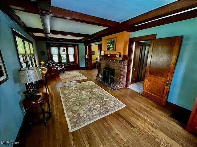 2508 Queenston Rd, Cleveland Heights, OH 44118 - living area featuring wood finished floors, beamed ceiling, baseboards, a fireplace, and coffered ceiling