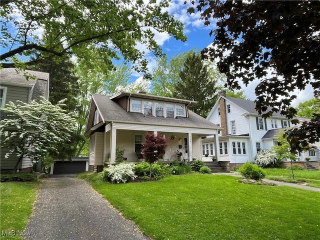 2508 Queenston Rd, Cleveland Heights, OH 44118 - view of front facade with a front lawn, covered porch, a chimney, and a shingled roof