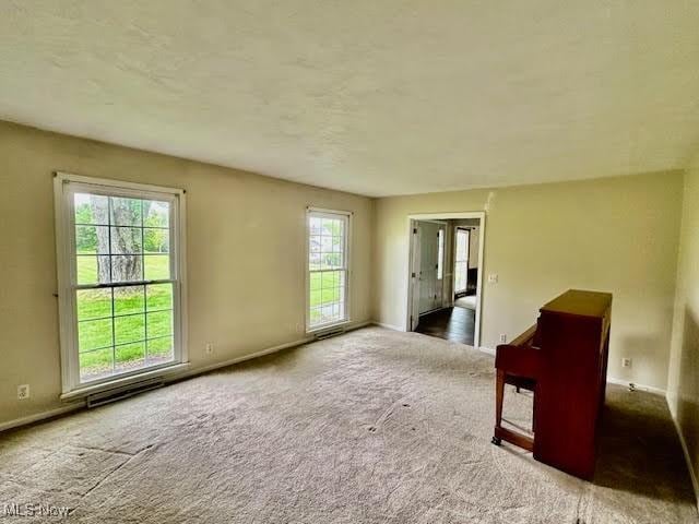 13053 Sarbaugh St SW, Navarre, OH 44662 - carpeted spare room with baseboards